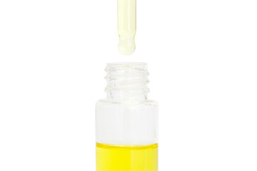 Small bottle of perfume isolated on a white background