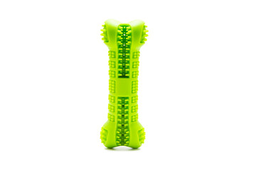 Dog toy, green rubber bone, on the table isolated on white