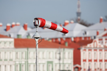 wind cone against the sky and the city