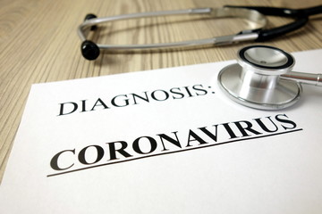Text diagnosis: coronavirus on medical document with stethoscope