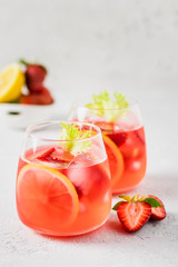 Summer iced strawberry lemon infused water cocktail. Selective focus, space for text.