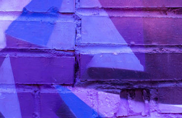 Beautiful bright colorful street art graffiti background. Abstract creative spray drawing fashion colors on the walls of the city. Urban Culture, black ,blue, purple , violet , neon texture