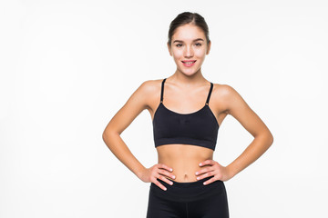 Young sporty muscular woman isolated against white background
