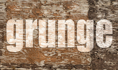 Piece of old and unpainted wood with the word grunge in 3d.