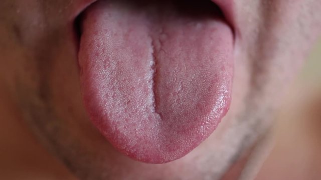 The man’s tongue is a muscular organ, therefore it is constantly moving.