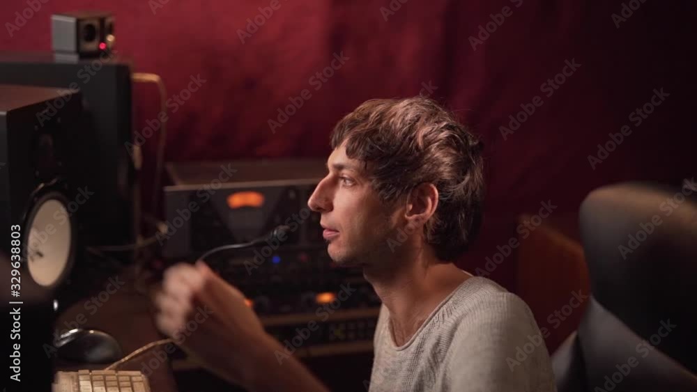 Poster man counts down to the beginning of recording in a recording studio