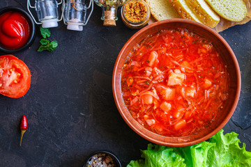 red tomato soup and vegetables and meat, borsch (Russian or Ukrainian cuisine) menu concept background. top view. copy space for text