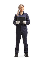 Female worker in an overall uniform holding a clipboard