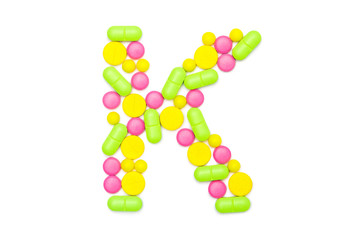 Alphabet of tablets and pills isolated on white