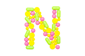 Alphabet of tablets and pills isolated on white