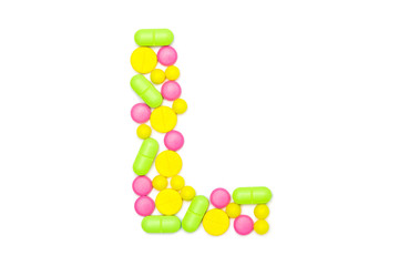Alphabet of tablets and pills isolated on white