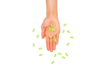 handful of tablets and pills in hand isolated on white