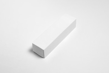 Blank packaging white Cardboard Paper Box  Mock up on white.Toothpaste package.High resolution photo.