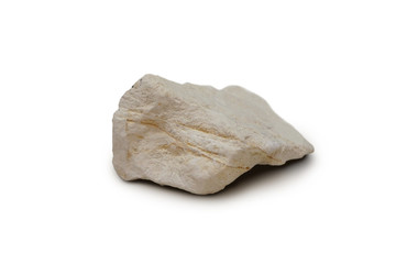 diatomite rock isolated on white background. It is a porous mineral called diatomaceous earth. There is noise and grain caused by the texture of the stone, soft focus.