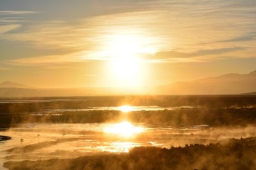 Fototapeta na wymiar the effect of the sunrise over the salt lake