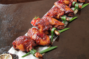  Grilled baked chicken wings with hot chili pepper and soy sauce.
