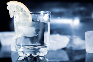 lemon on vodka of glass