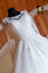 Fototapeta na wymiar wedding dress in the room of the bride, around flowers and decoration. Wedding day