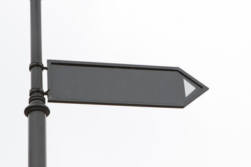 Obraz premium one blank unsigned arrow pointer showing direction, the road sign is on the street on a white background