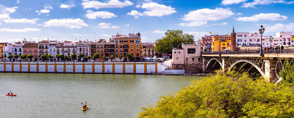 Panoramic view of the neighborhood of Triana along Guadalquivir river in Seville, Spain.