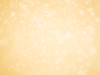 Golden background with soft bokeh lights.