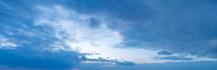 Large panorama of evening sunset sky with beautiful clouds.