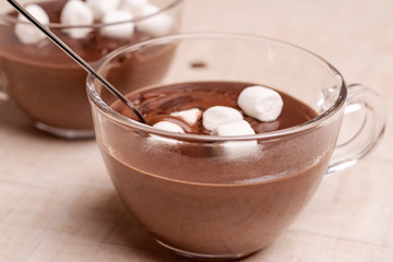 hot chocolate with marshmallows on a wooden background