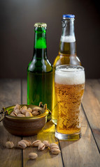 Light beer in a glass, on an old background. 