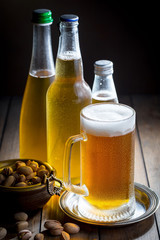 Light beer in a glass, on an old background. 