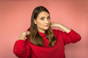 young woman in a bright red hoodie