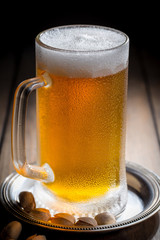 Light beer in a glass on the table