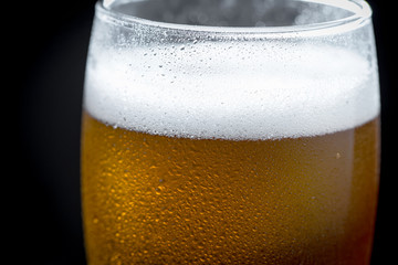 Light beer in a glass on the table