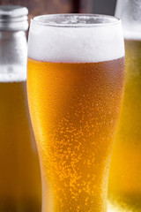 Light beer in a glass on the table