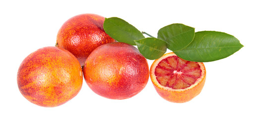 Composition with sliced and unpeeled ripe blood orange with green leaf isolated on white background