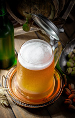 Light beer in a glass, on an old background. 