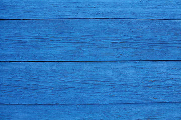 Old wooden boards painted blue. Close-up. Horizontal view. Background. Texture.