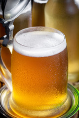 Light beer in a glass on the table