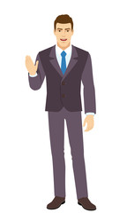 Smiling Businessman greeting someone with his hand raised up. Full length portrait of Businessman in a flat style.