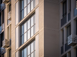 Modern residential multi-story building. Windows of new apartments. Close-up