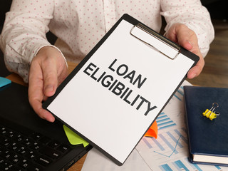 Conceptual hand written text showing loan eligibility