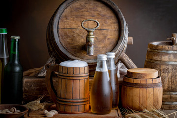 Light beer in a glass on a table in composition with accessories on an old background