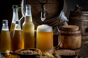 Light beer in a glass, on an old background.