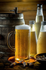 Light beer in a glass, on an old background.