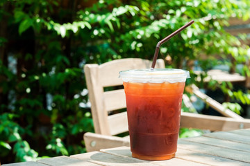 A glass of ice americano coffee in cafe