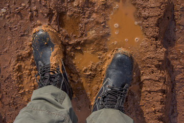 Working shoes on a dirty road. Demi-season work shoes