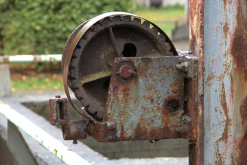 Gear wheel, roller on a rusted steel beam