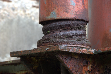 large eroded shock absorber, vibration damper in a disused factory