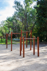 View of wooden bars for training in a sports area of a park in Madrid, Spain. In vertical