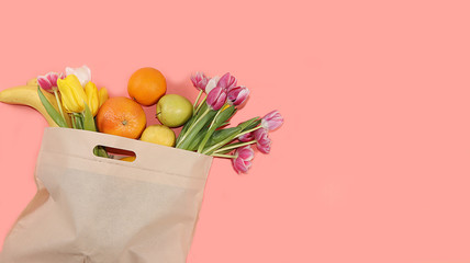 Healthy natural products in an eco bag on a bright background, the concept of a healthy lifestyle and weight loss, zero waste. Vegetables, fruits in tissue packaging, diet. Banner for the store. No pl