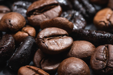 Macro view of natural and roasted coffee mix beans